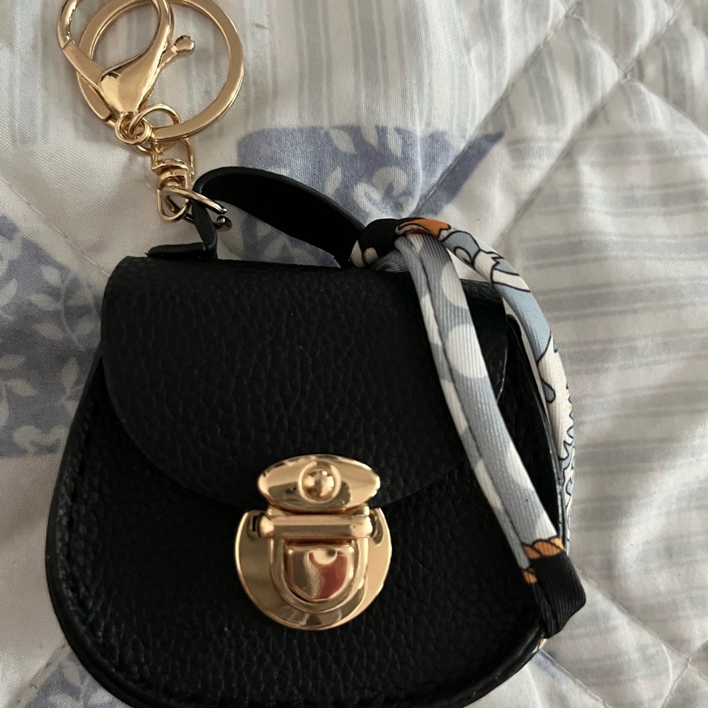 Elegant Black Mini Bag with Gold Accents keychain